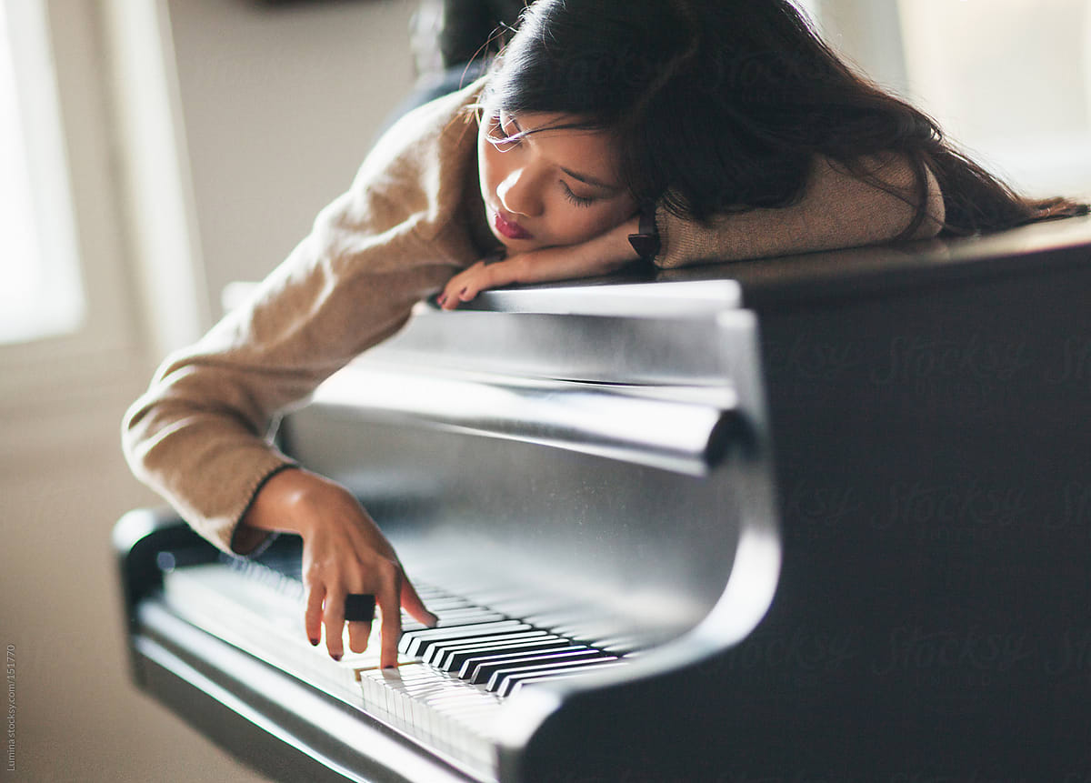 Woman Daydreaming on the Piano