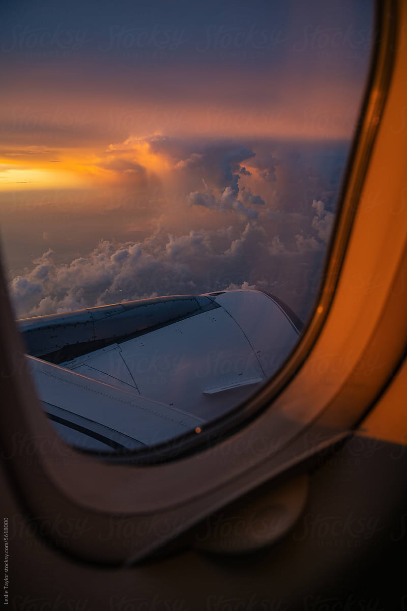 Sunset And Storms From Airplane Window