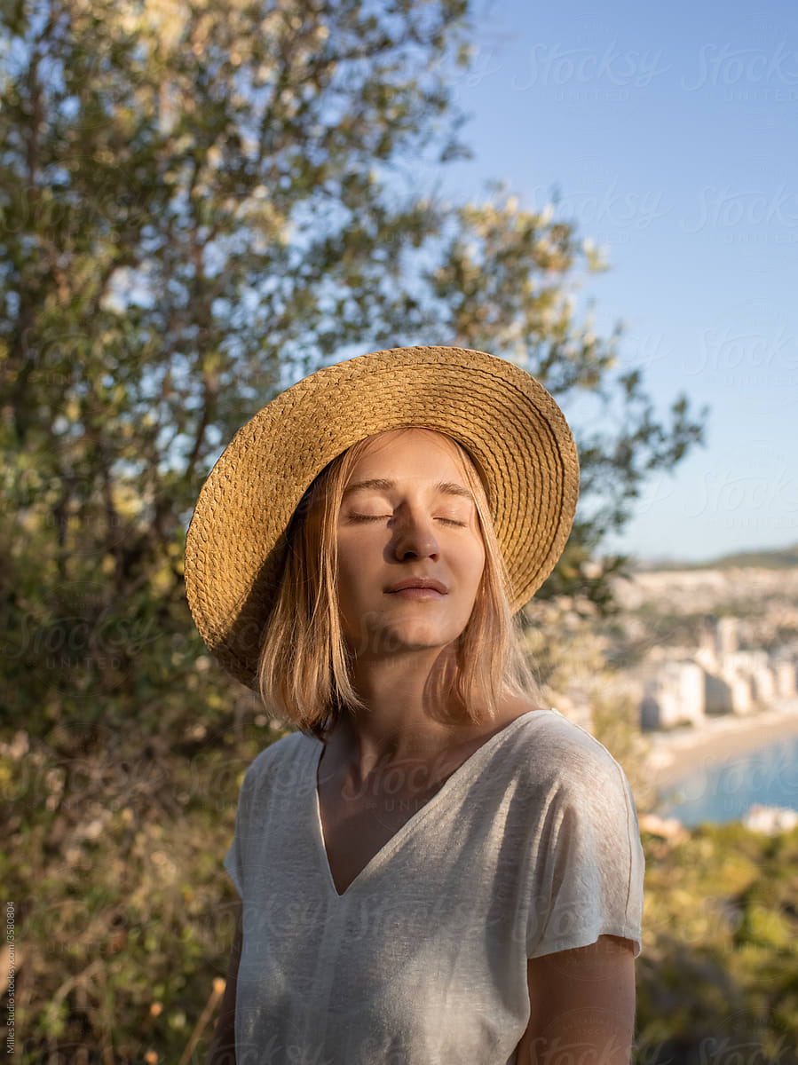 Female tourist breathing fresh air in daytime
