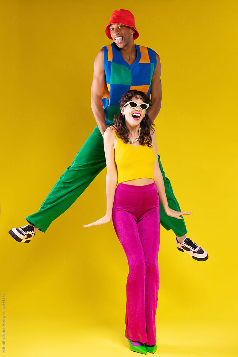 Couple in retro outfits having fun