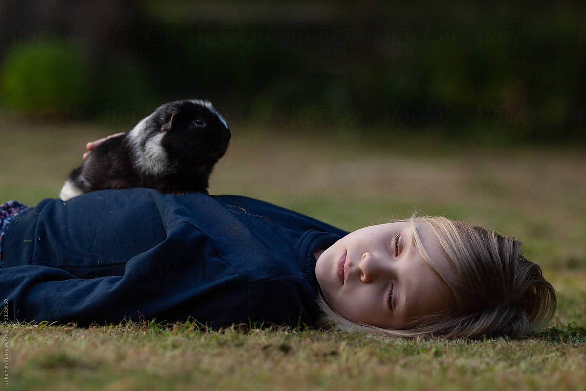 A girl and her guinea pig.