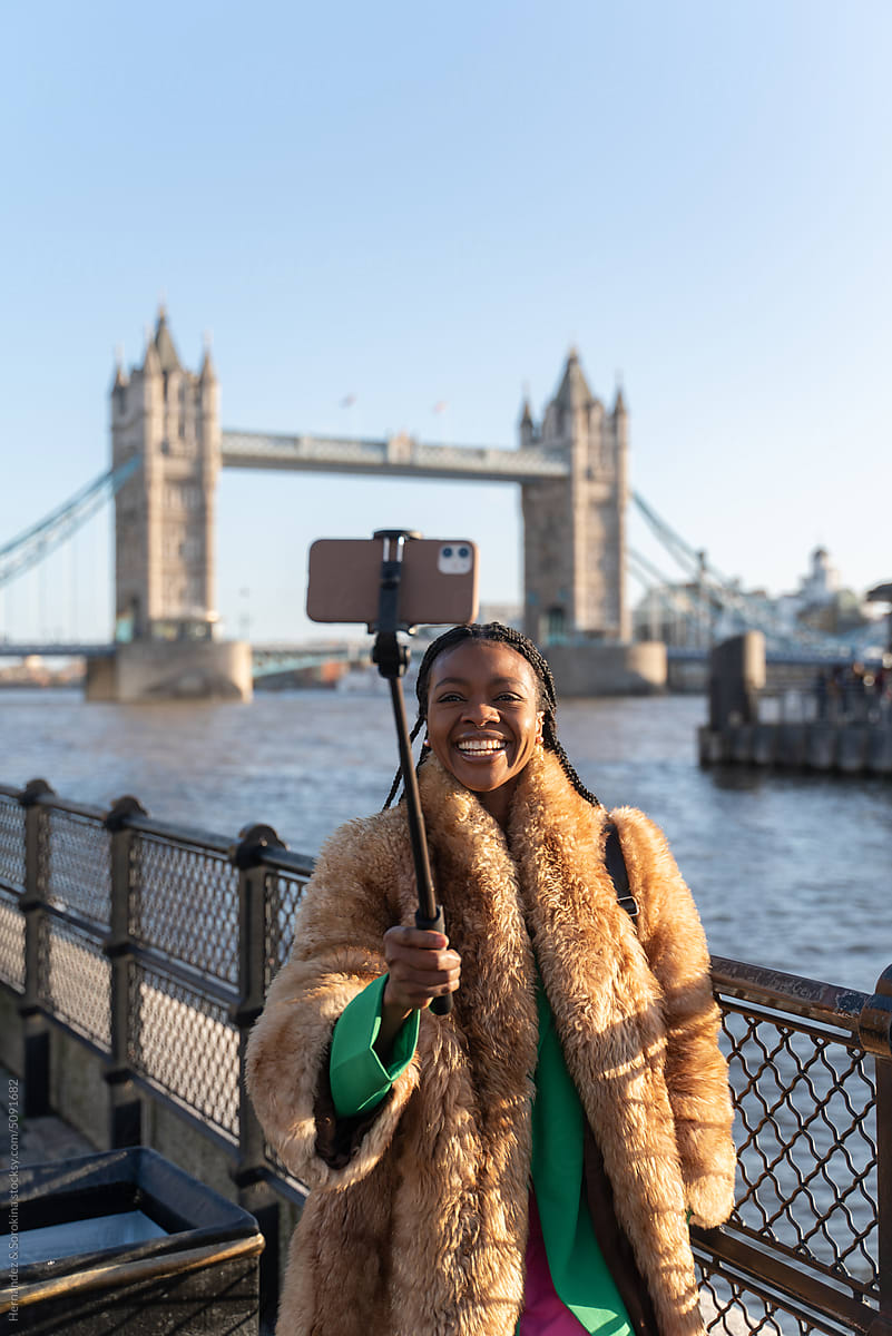 Woman Using Phone To Do Selfie In London