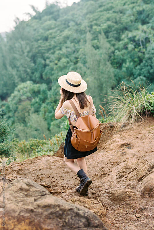 Young woman hiking on tropical trail