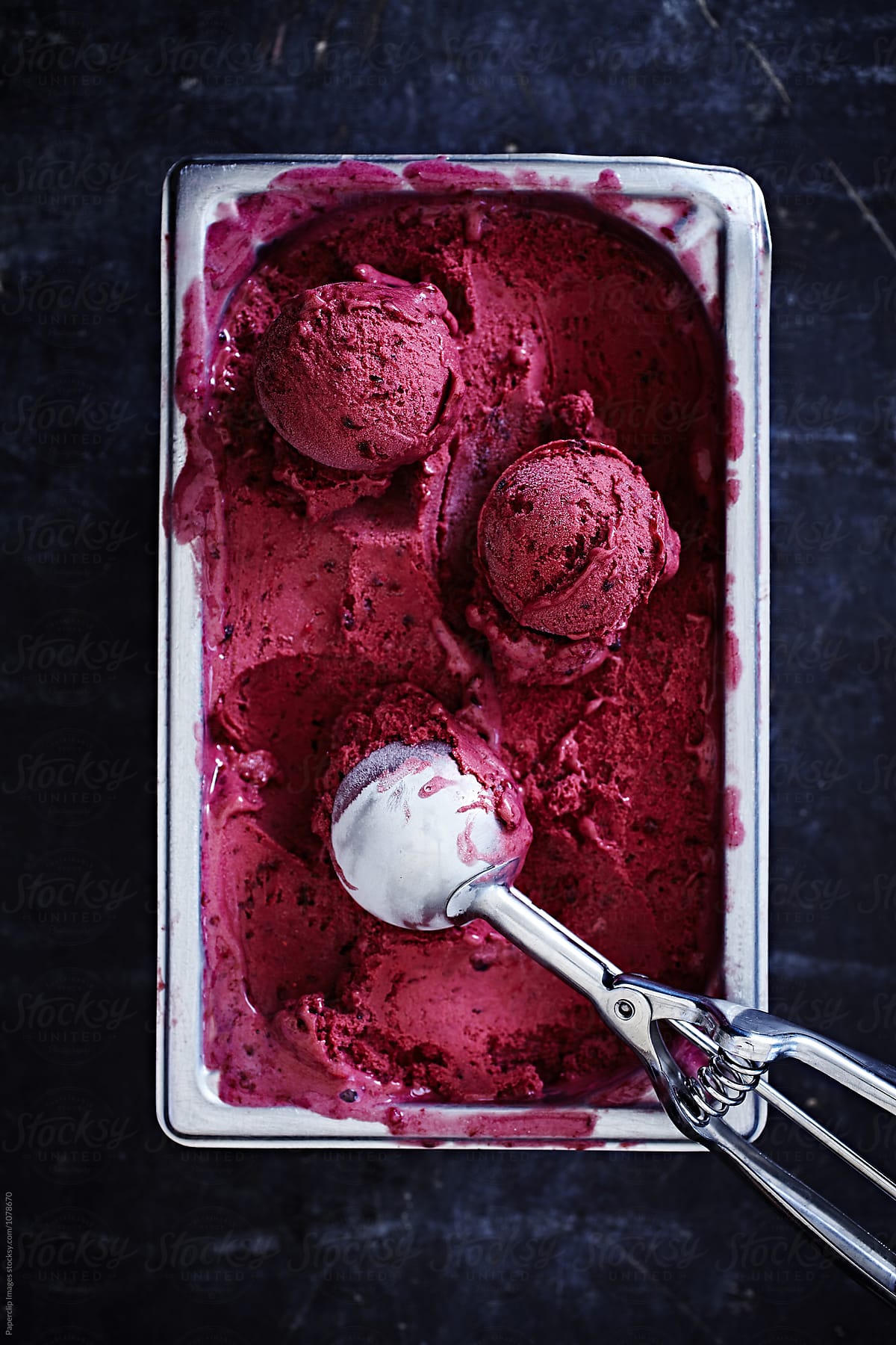 Blueberry ice cream with scoop