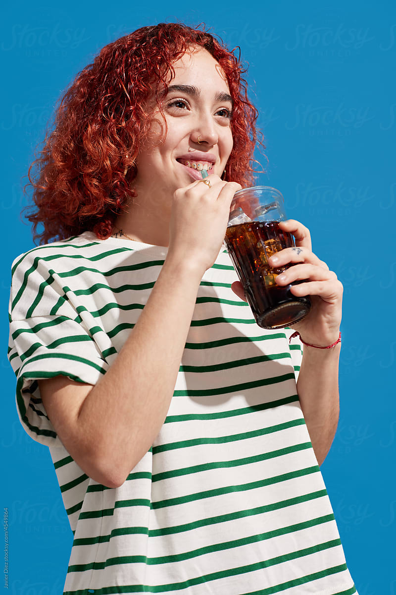 Young Woman Drinking Coke