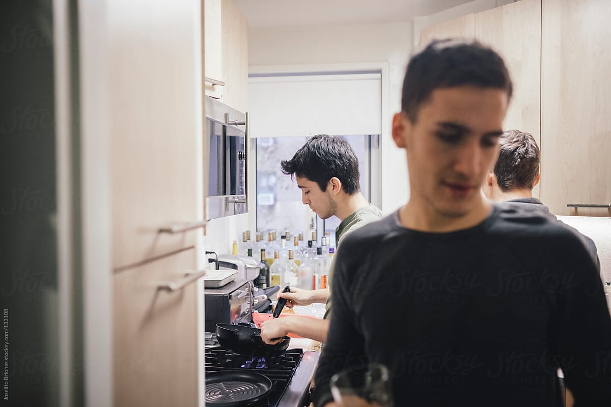 Student Roommates Preparing Breakfast in the Kitchen of their New York Apartment