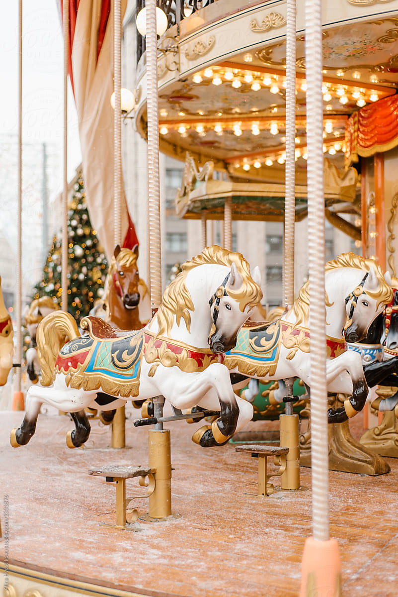 Beautiful horses on merry-go-round in park