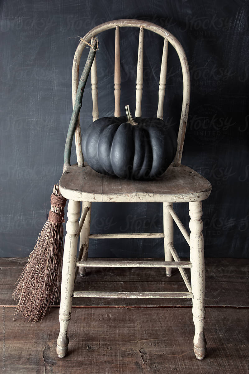 Black pumpkin on chair