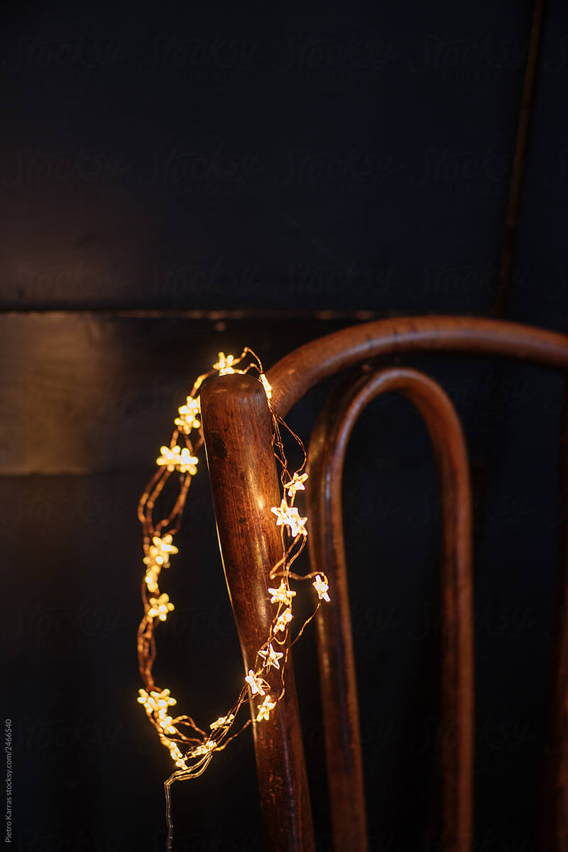Fairy lights hanging on chair