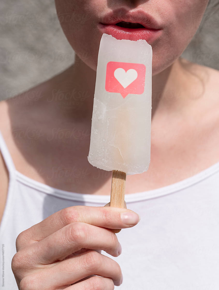 Woman licks ice lolly with like icon