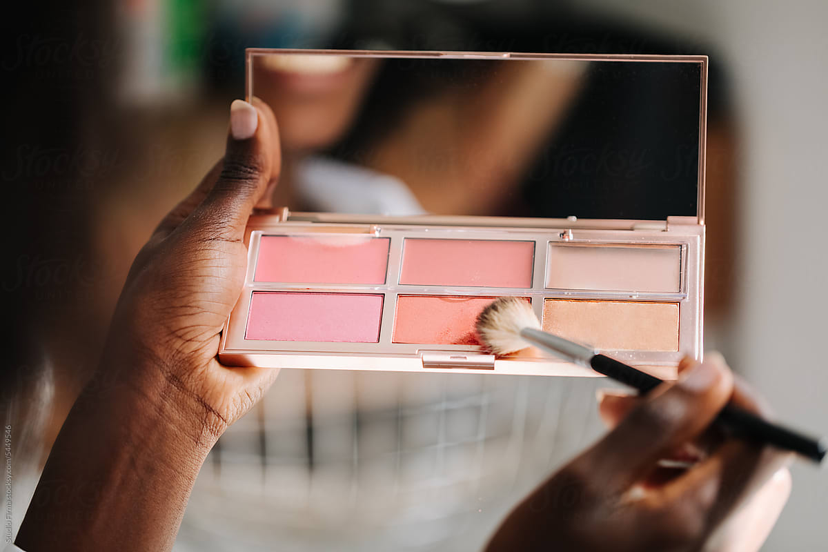 Woman Holding Blush Palette in Beauty Salon