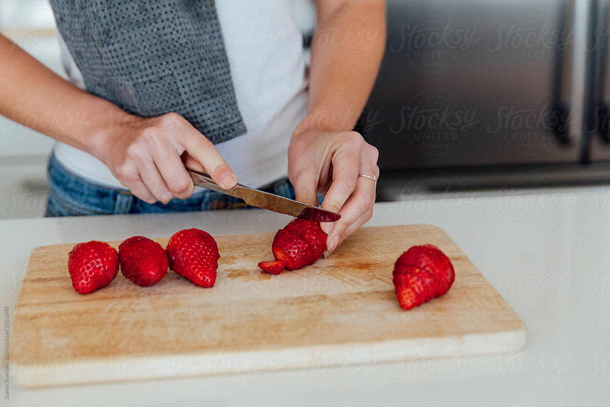 Italian Woman Slicing Strawberries
