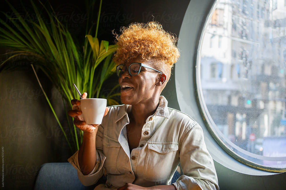 Happy Black Woman Drinking Coffee.