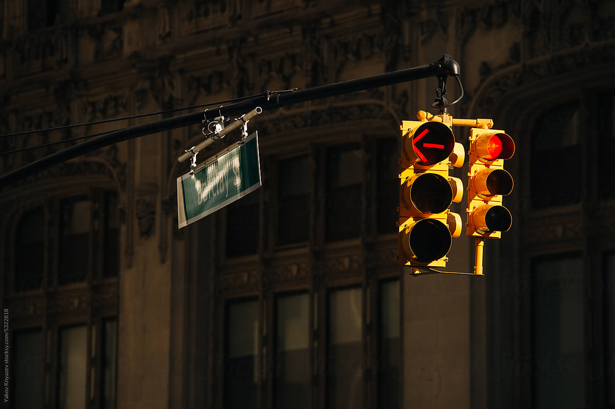 Yellow American Traffic Light Lit By The Sun Hanging Above The