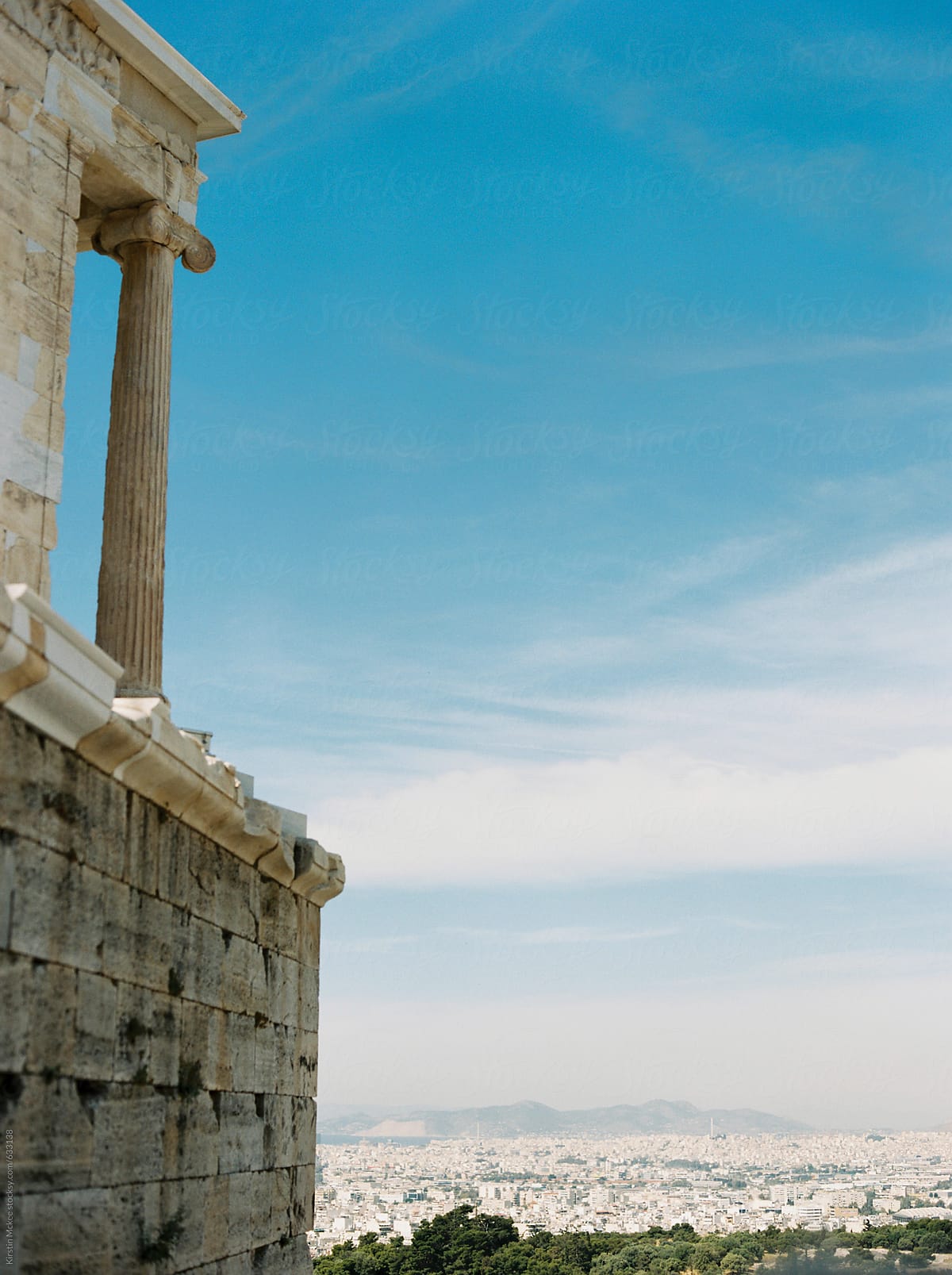 Detail from the Parthenon with view of Athens behind