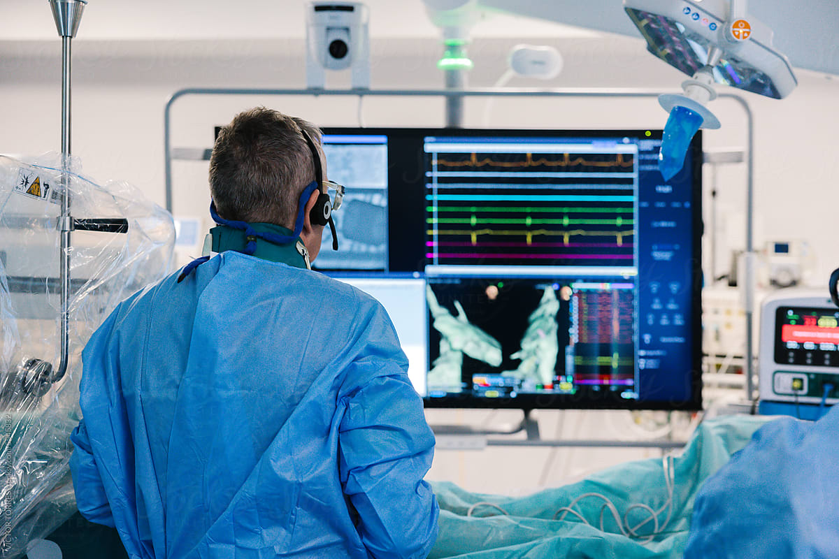 Male doctor during robotic electrophysiology operation