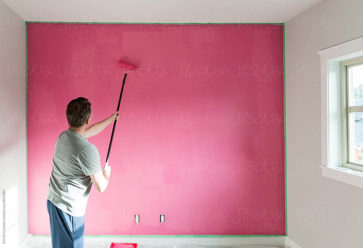 Man Painting A Wall Pink