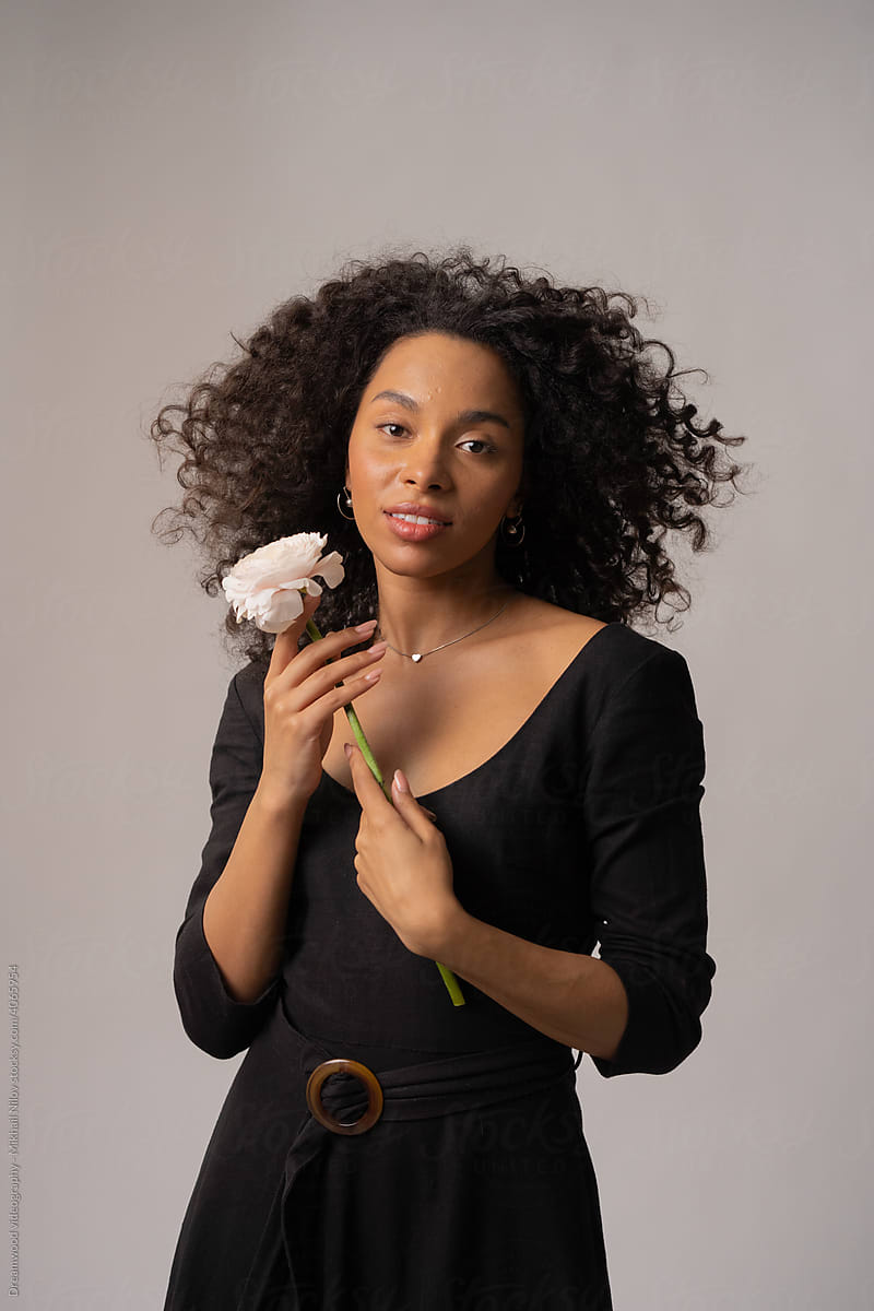 Beautiful woman holding a flower