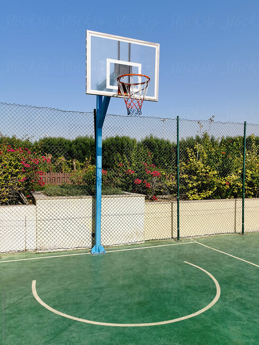 green basketball court and hoop outdoor