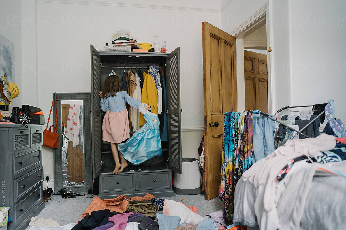 Girl playing in a room with closet