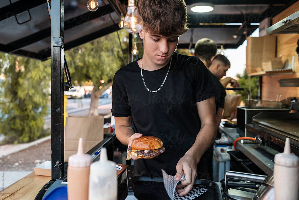 Small busines owner cooking in a food truck