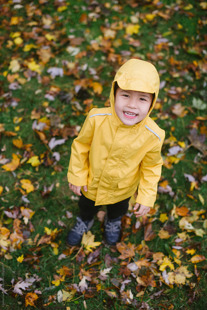 Happy kid playing in rain