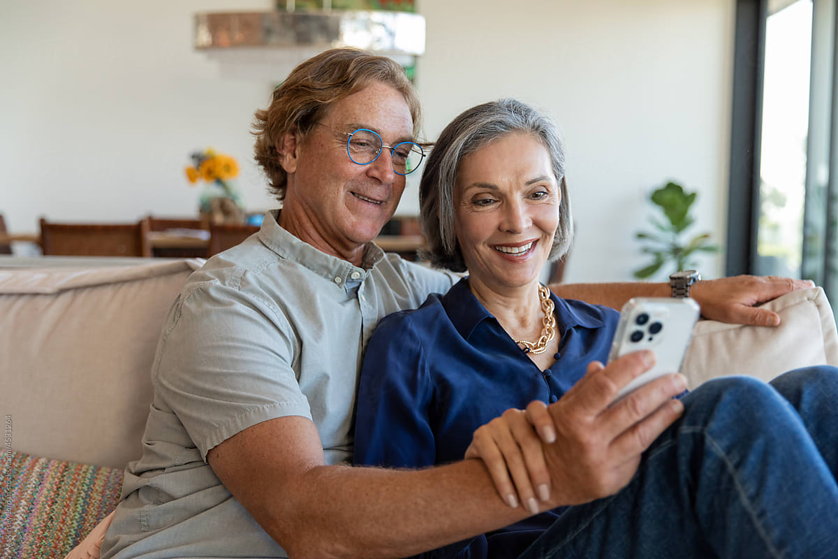 Retired Couple Share a Moment on Their Phone