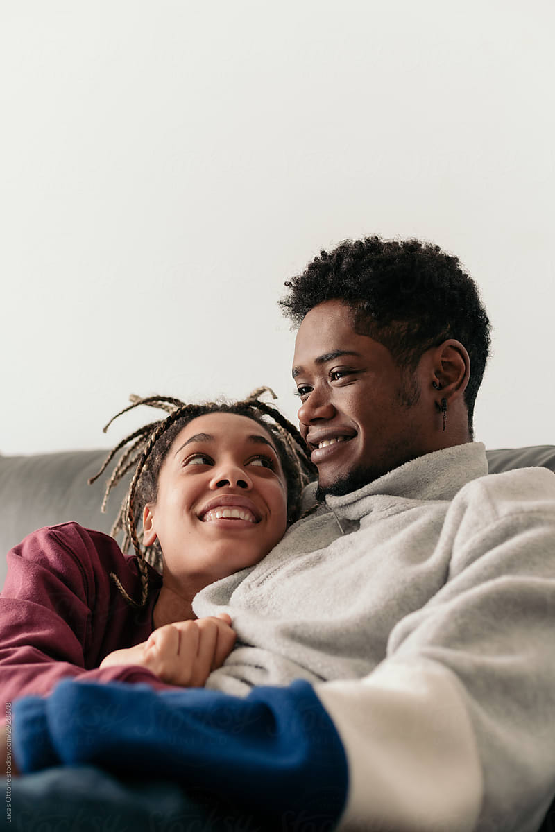 Multiracial Couple Chilling At Home By Stocksy Contributor Lucas