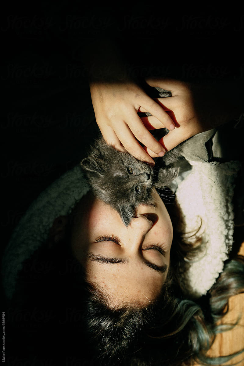Girl Hugging a Kitten