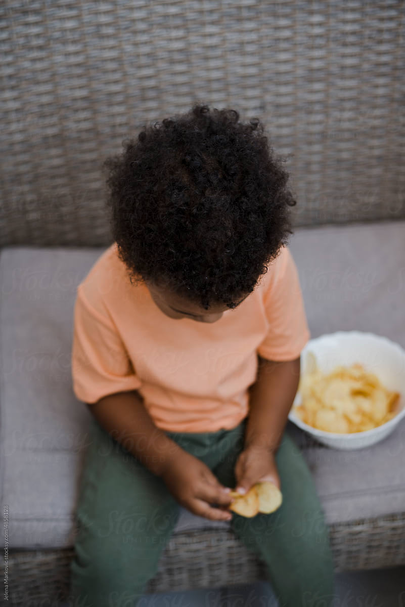 Toddler eating chips