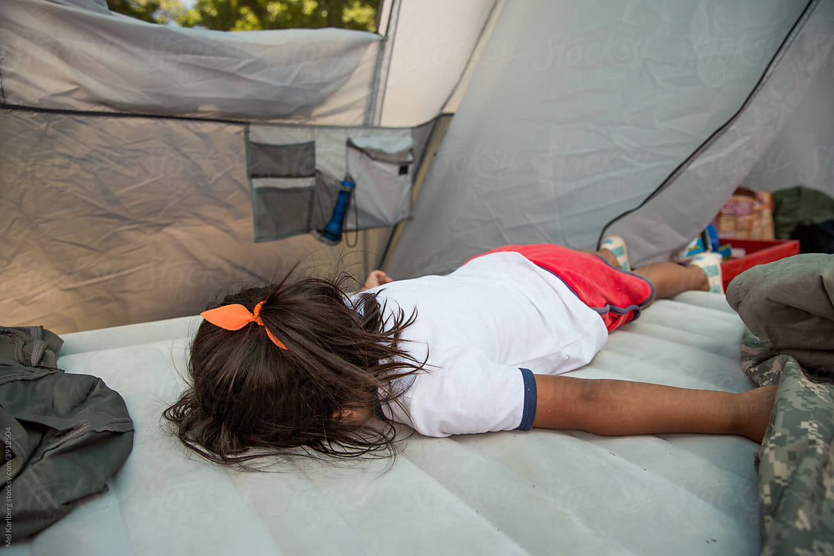 Girl trying to sleep in a tent