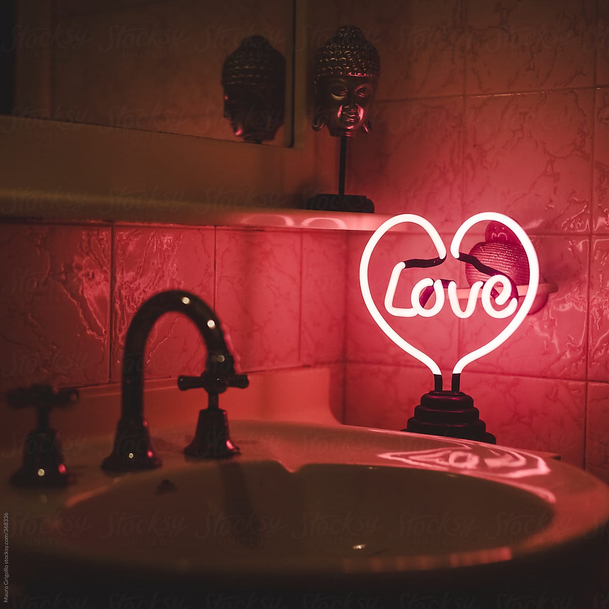 Love neon sign inside a toilet