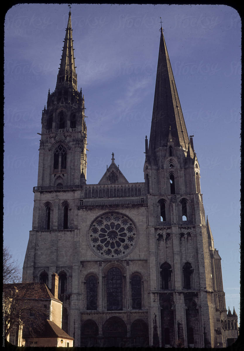 70's film photo. Facade of Gothic Chartres Cathedral in France.