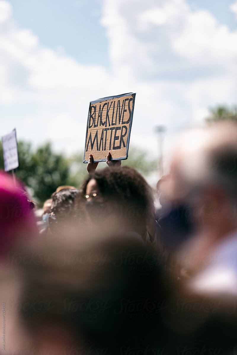 BLM: Protestor Holds Up BlackLivesMatter Sign