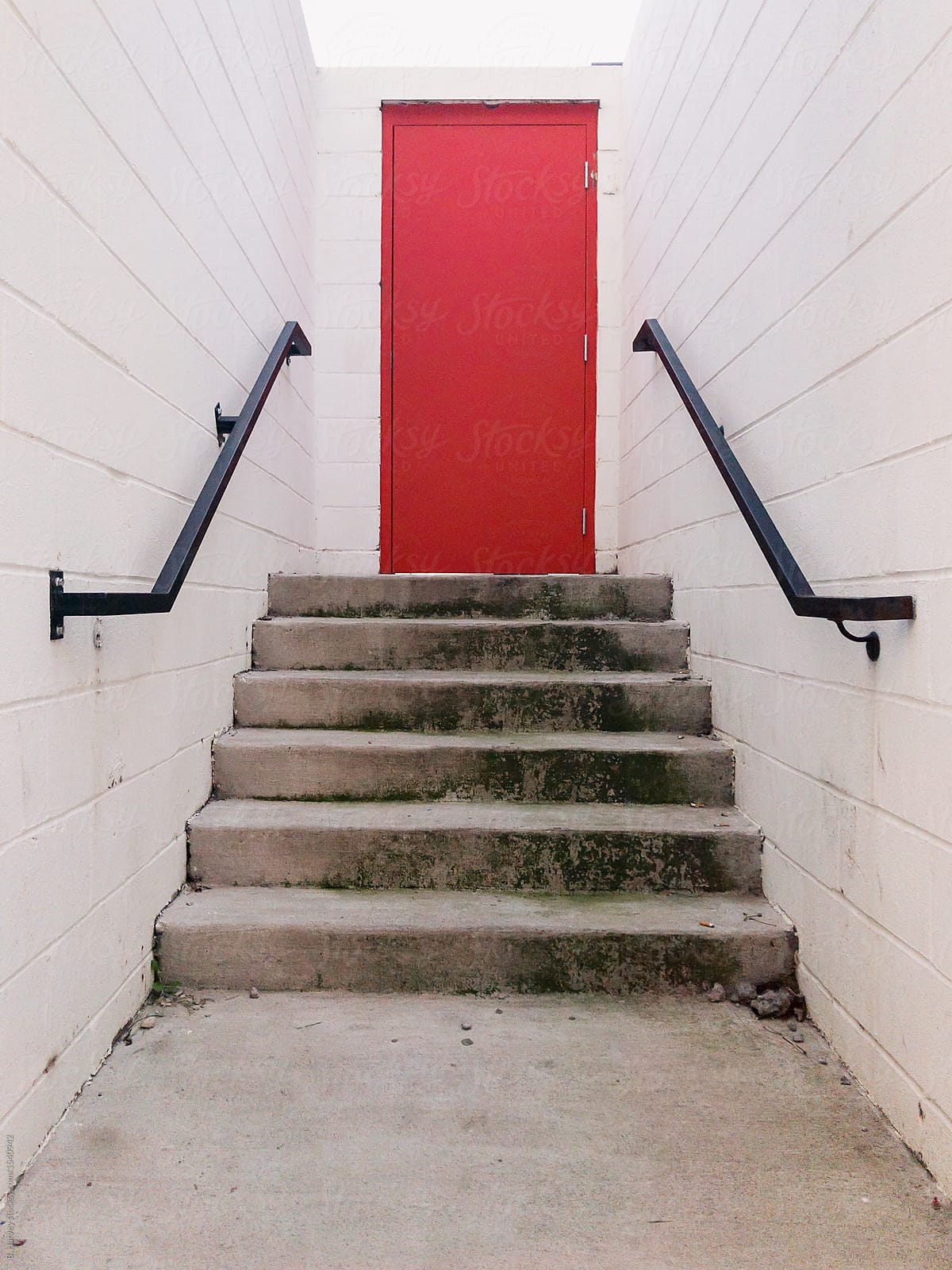 Red Door at the End of a Hallway