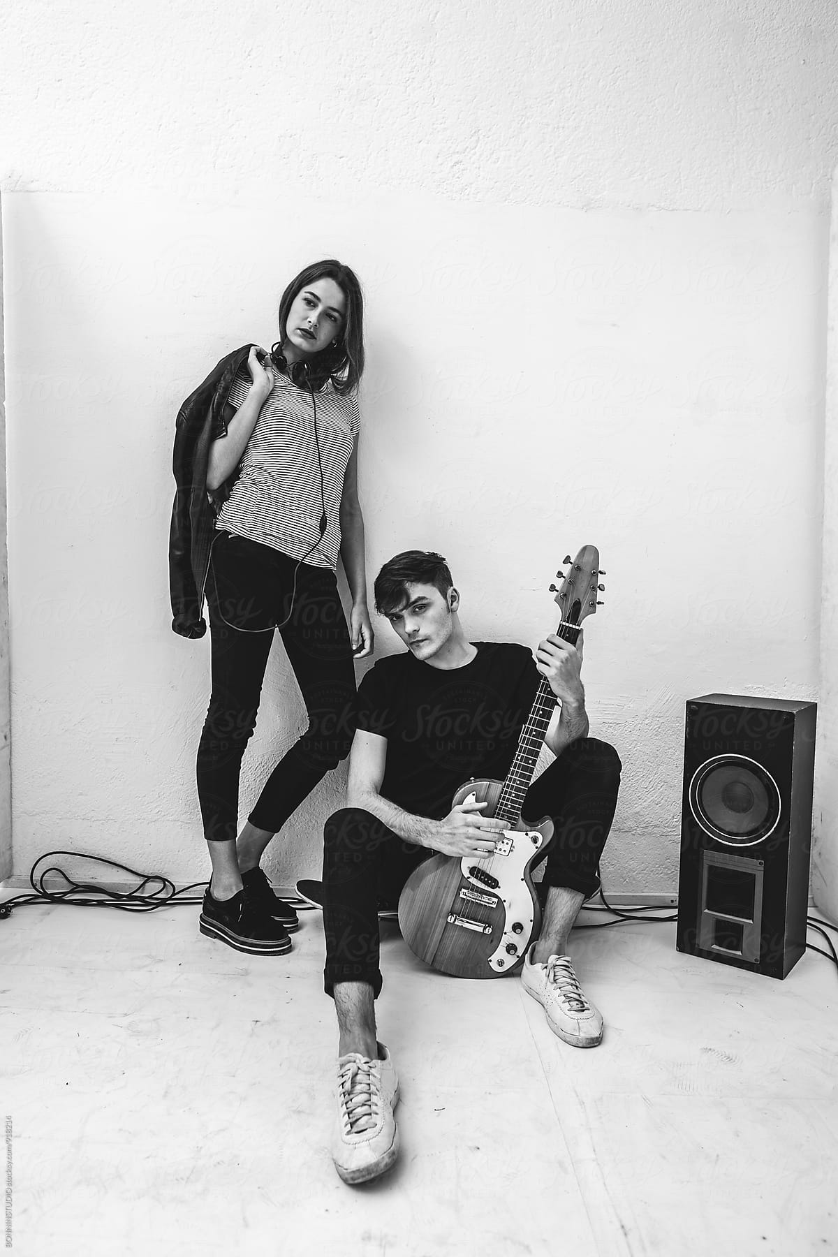 Portrait of rockers couple at recording studio.