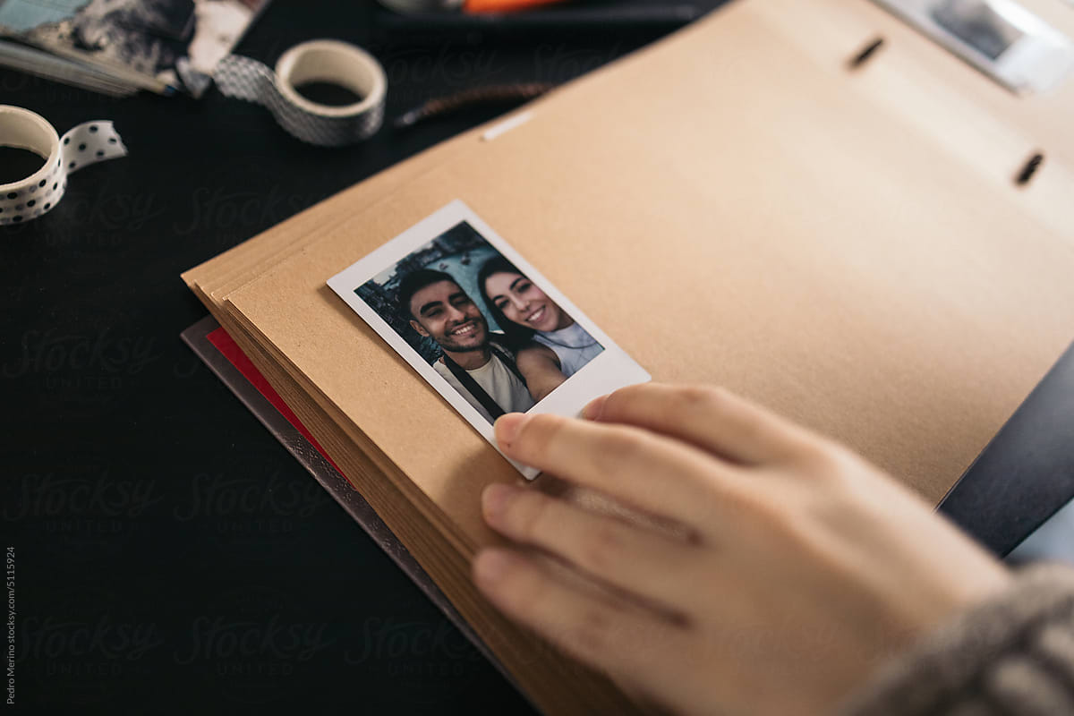 Scrapbook With Polaroid Photos by Stocksy Contributor Pedro Merino -  Stocksy
