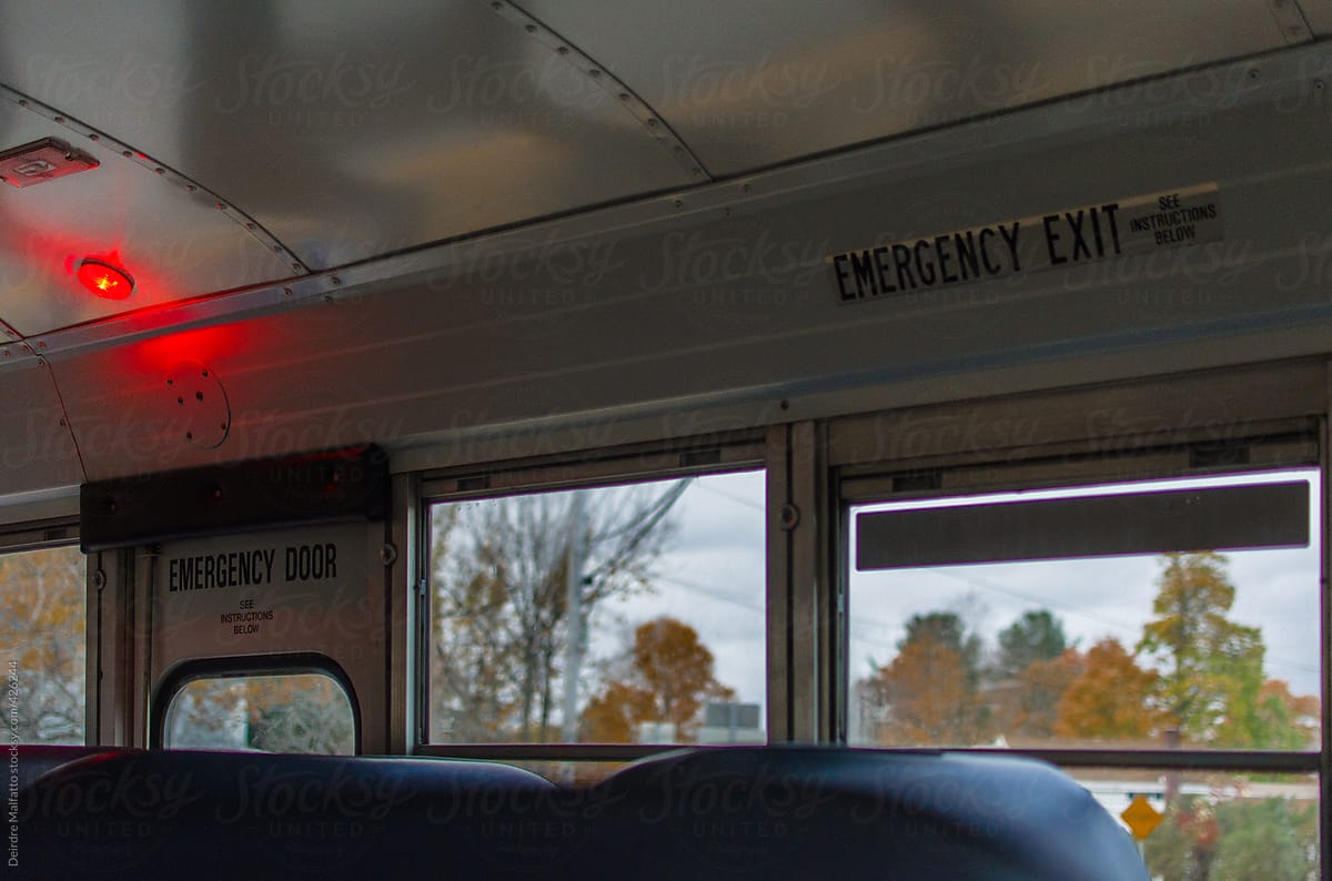 inside a schoolbus, looking at the emergency exit