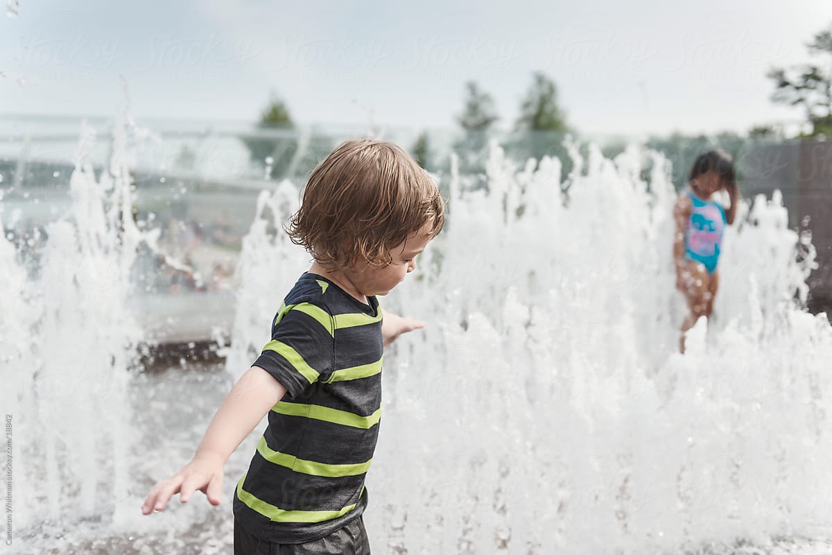 Boy playing in a splash park
