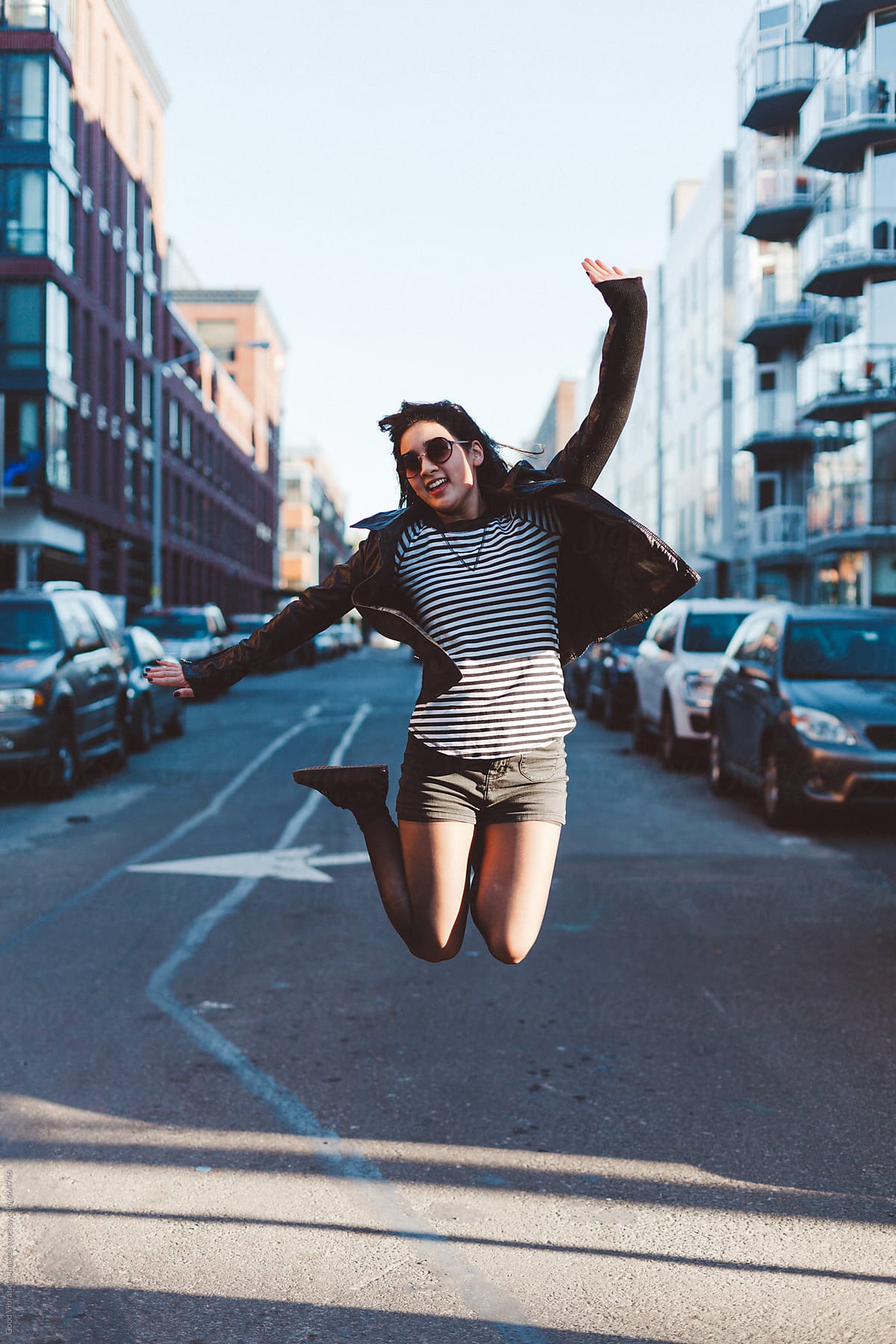 Happy young woman jumping in New York