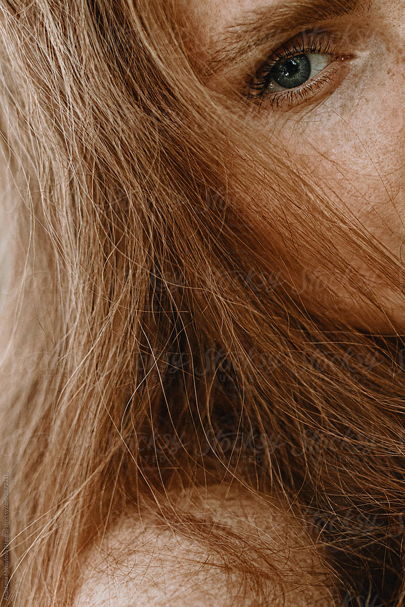 Close Up woman's portrait of Ginger female with many freckles
