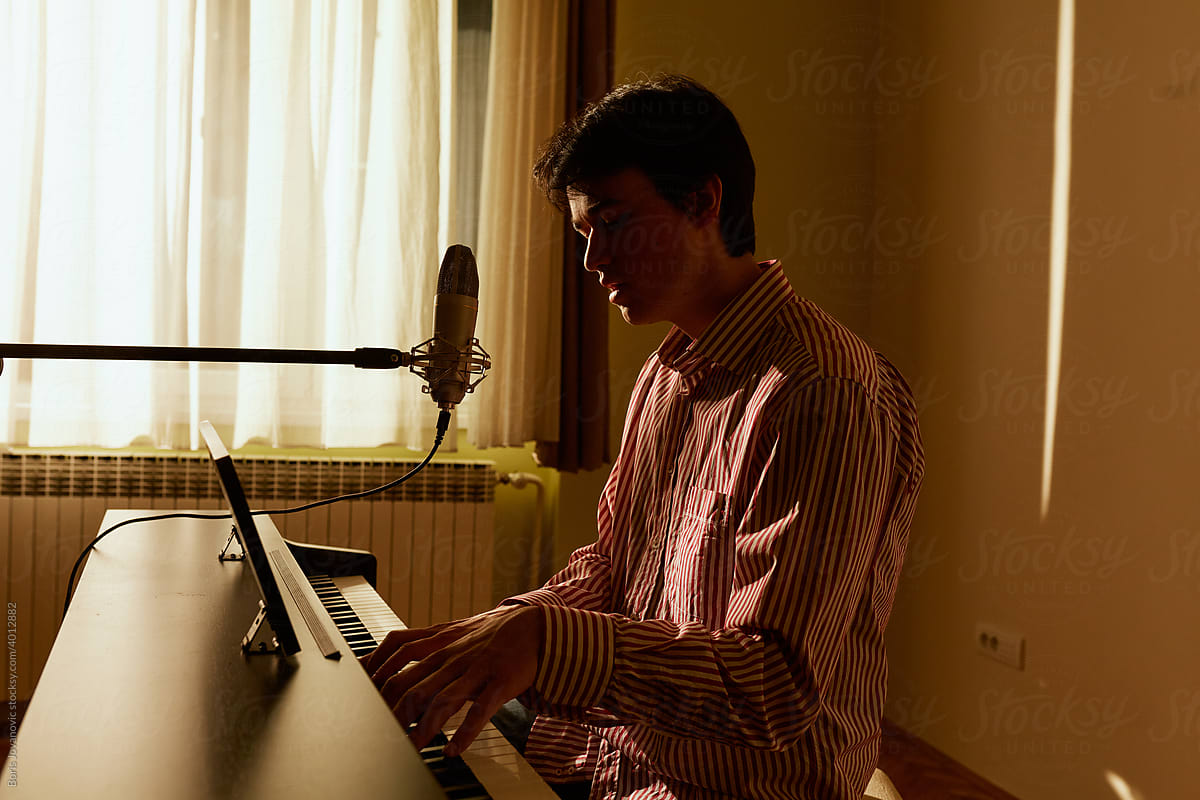 Man Singing While Playing The Piano