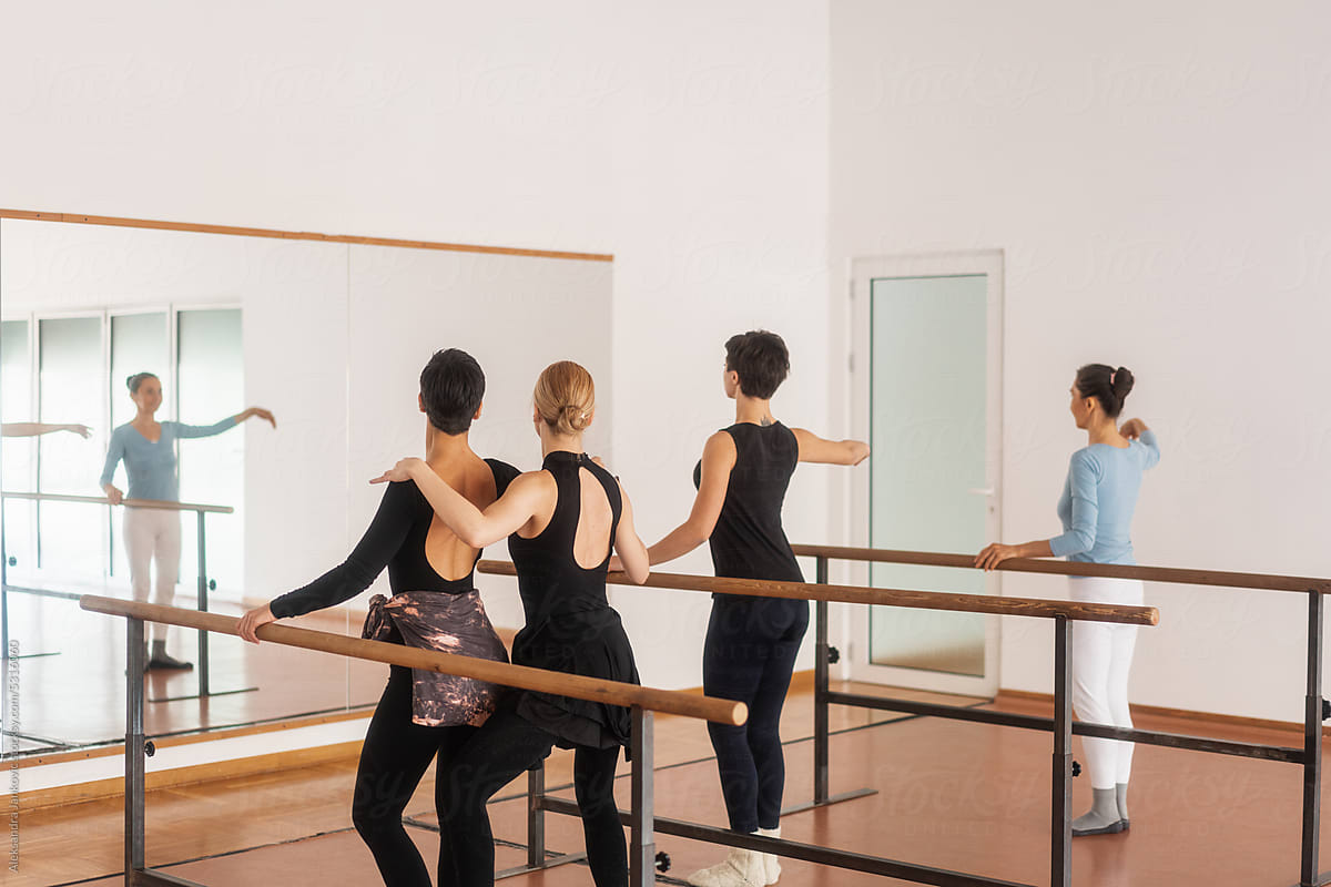 Anonymous Women Practicing A Ballet Routine With A Teacher