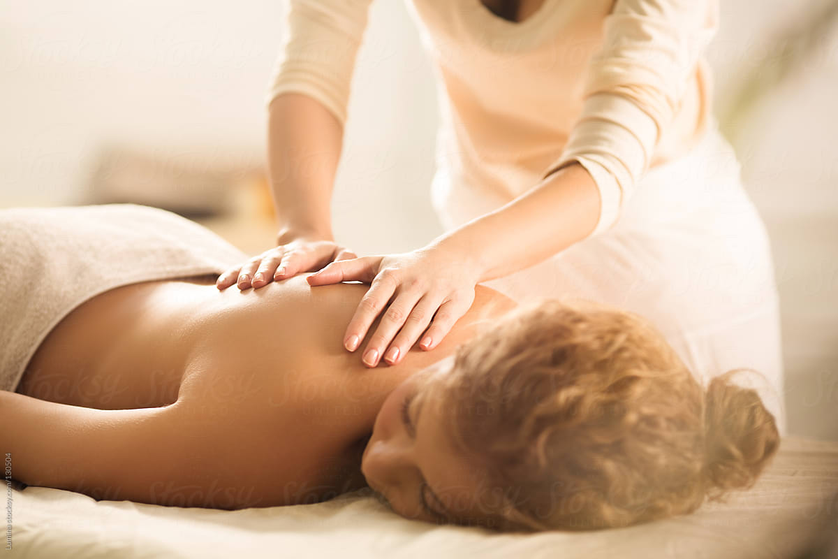 Woman Enjoying A Back Massage By Stocksy Contributor Lumina Stocksy