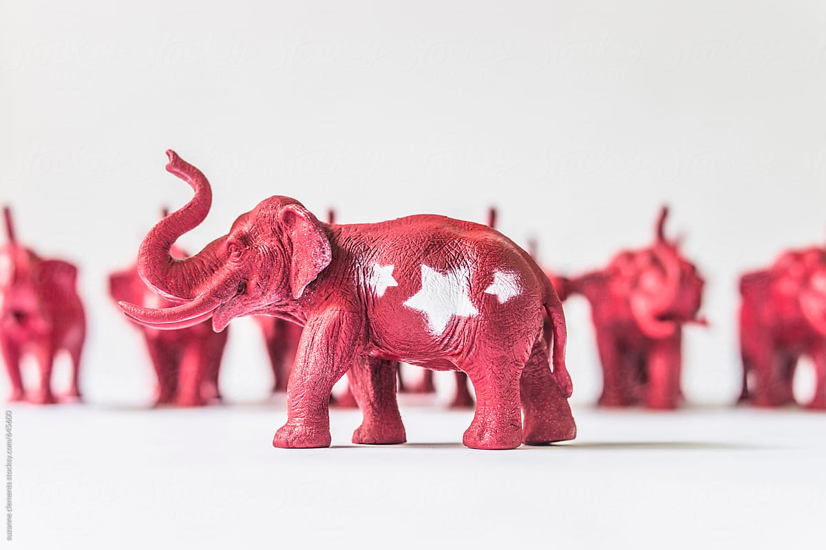 United States Republican Elephant Standing infront of A Row of Red Elephants