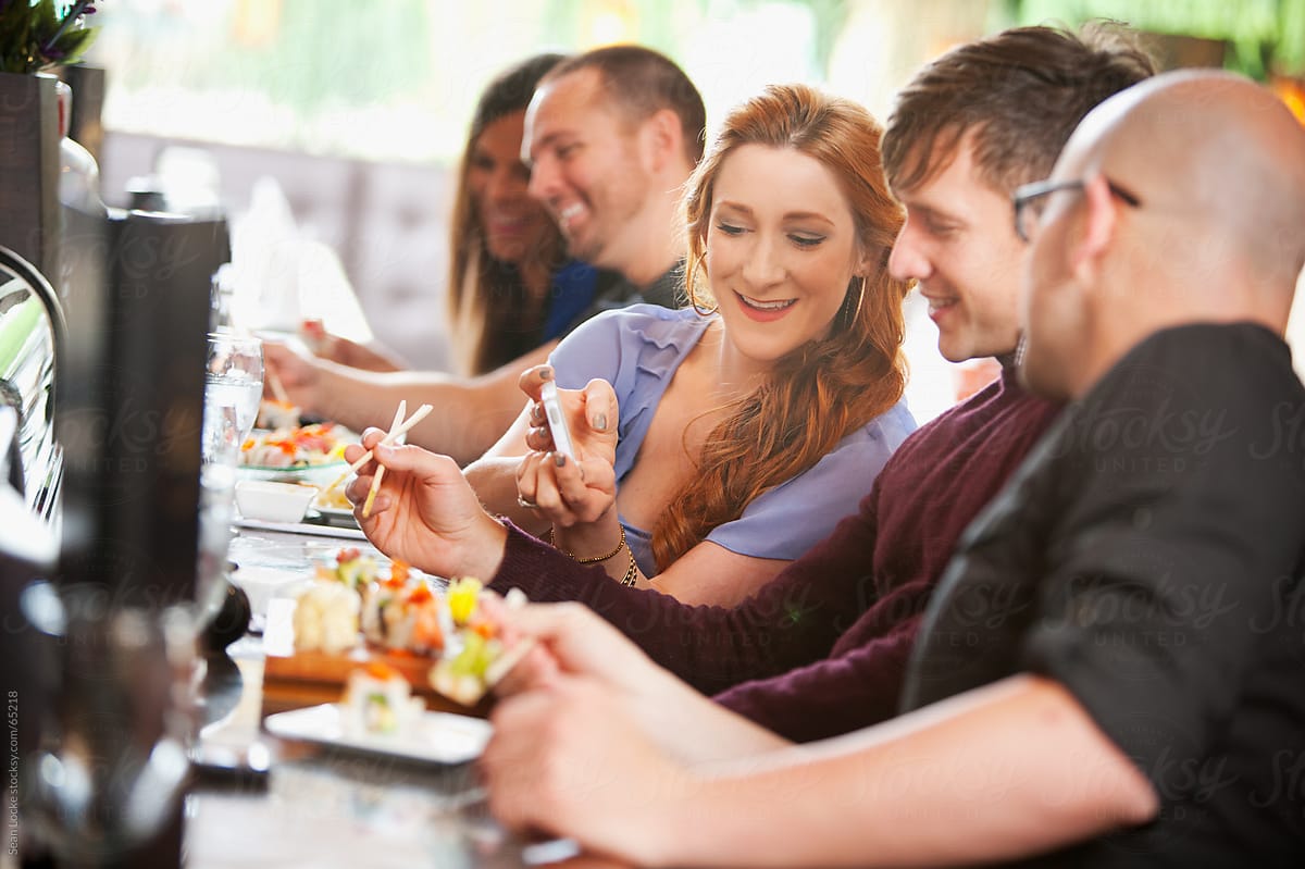 Sushi: Woman Shows Friend Photo of Lunch