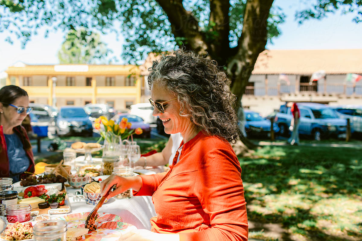 Woman serving her plate at picnic