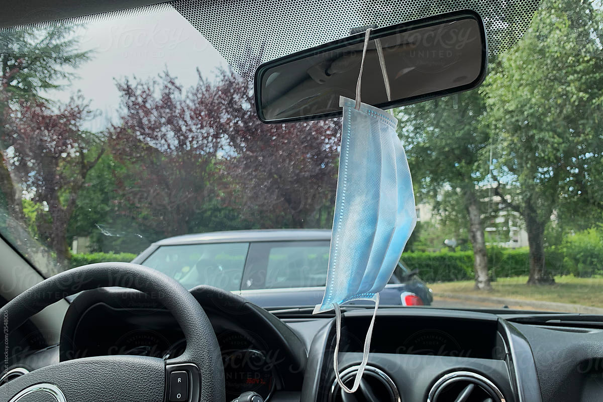 face mask hanging in the car during covid-19 pandemic of coronavirus