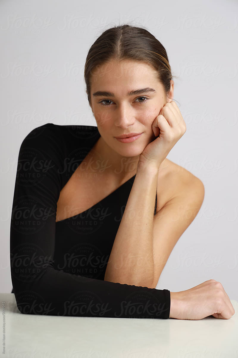 young woman leaning on table