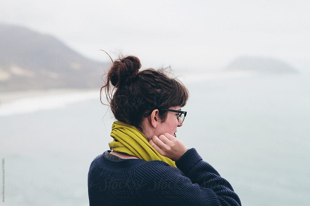young woman looks out at the ocean